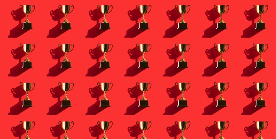 A picture of an award repeatedly on a red background.