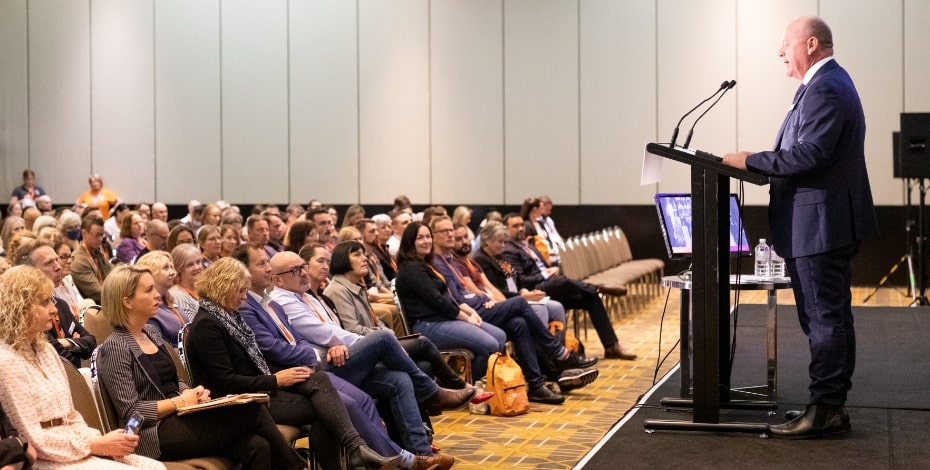 Speaker Scott Willis addresses a crowd of people.