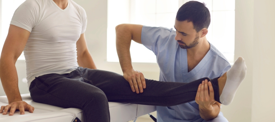 Physiotherapist working on a persons leg