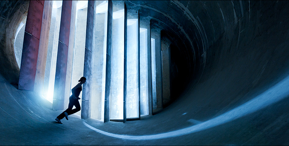 A graphic image of a person running against a colourful background.