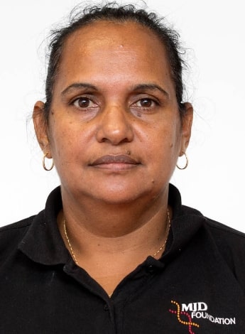 The image shows an Indigenous Australian woman with her hair pulled back.