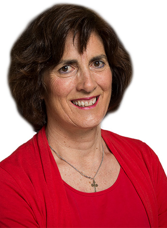 "A woman with short brown hair and wearing a red top is looking at the camera"